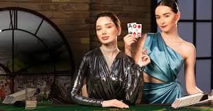 Mobile device showing Playtech blackjack table with betting interface and dealer video